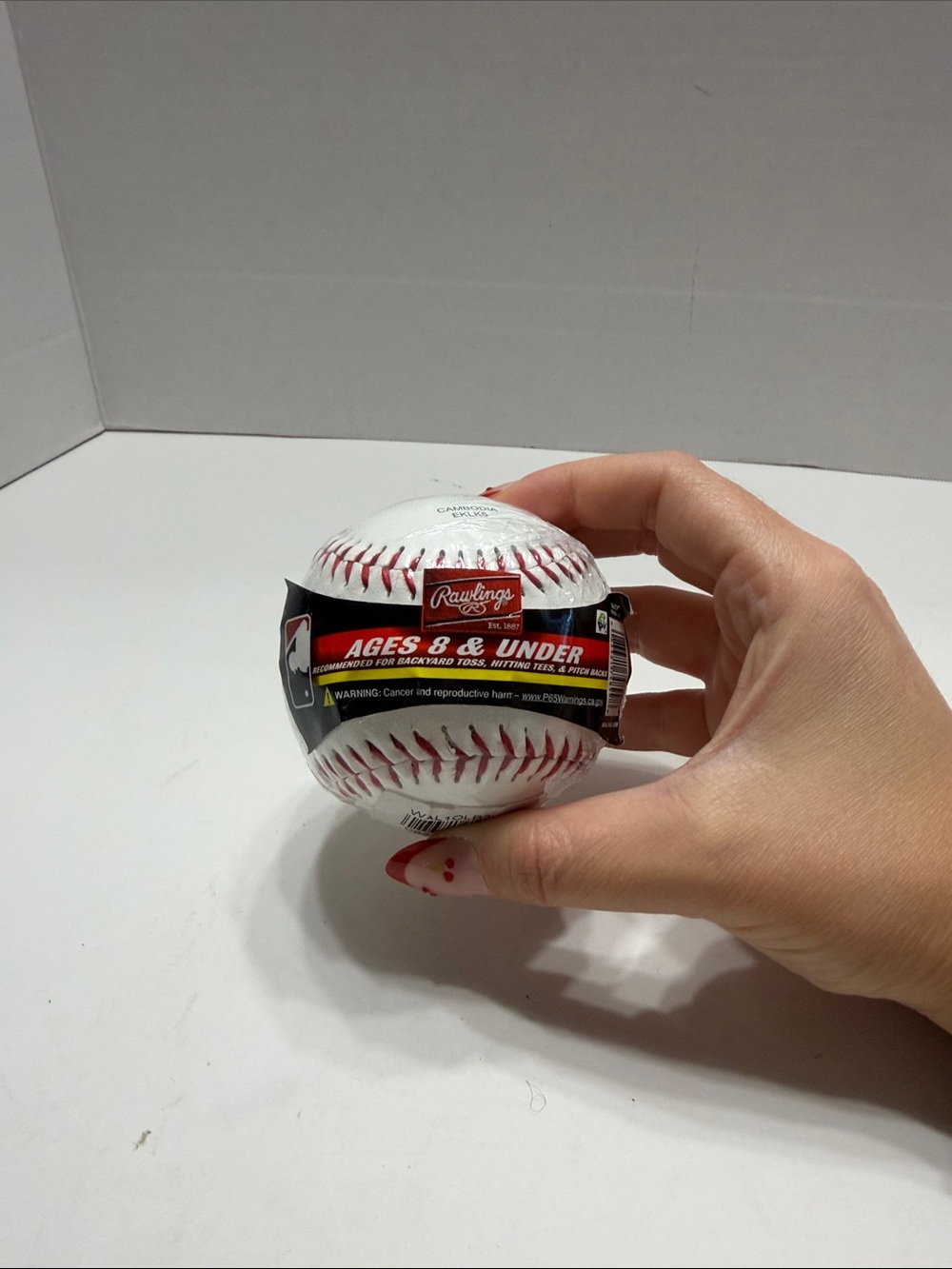 Rawlings White Baseball with Red Stitching and Black Label